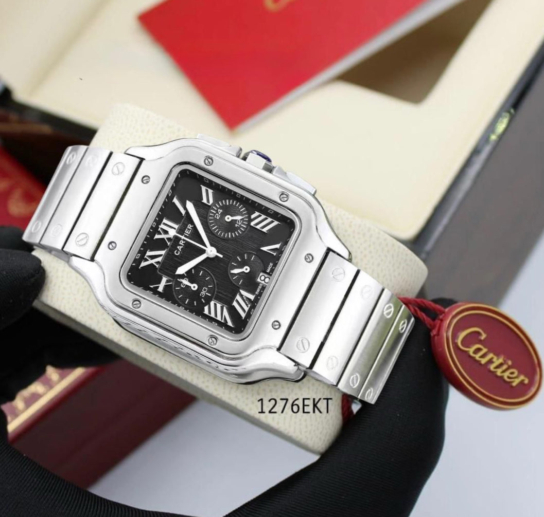 Cartier watch held by a gloved hand with a Cartier box in the background