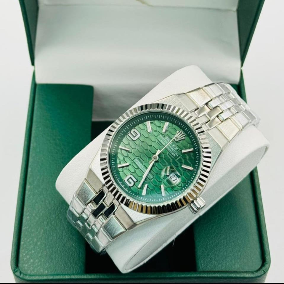 Rolex watch with green dial and white strap in a green box